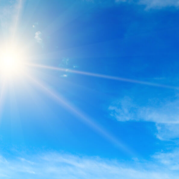 Blue sky. Bright midday sun illuminates the space. Wide photo .